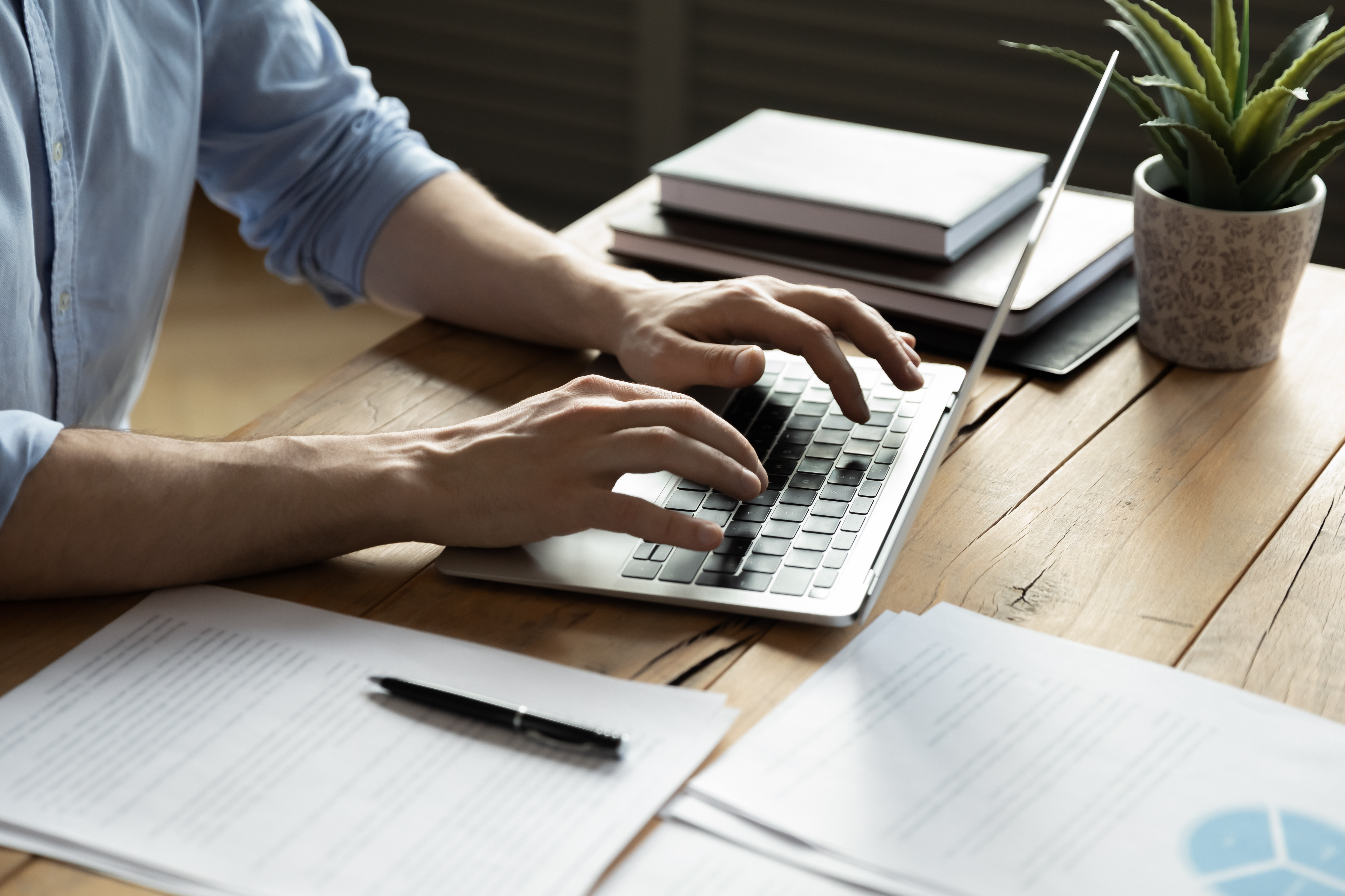 Man writing on laptop